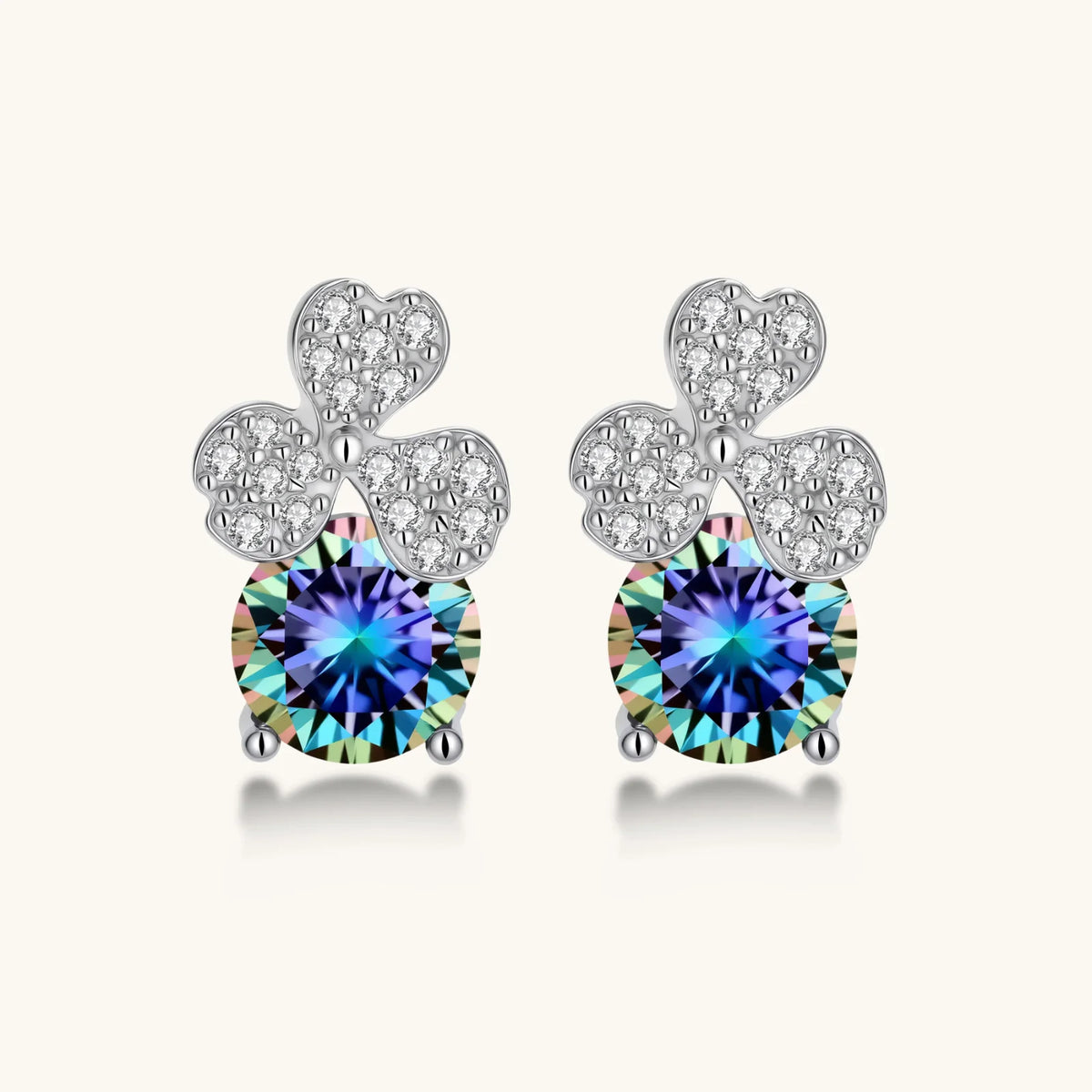 Sterling silver stud earrings with four-leaf clover design featuring small crystals above round moissanite stones