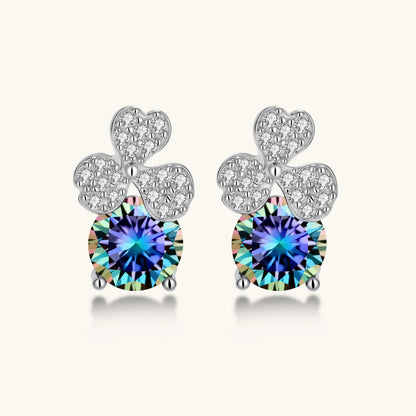Sterling silver stud earrings with four-leaf clover design featuring small crystals above round moissanite stones