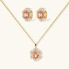 Ornate gold-plated jewelry set featuring peach center stone surrounded by clear AAA cubic zirconia crystals