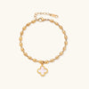 18K gold-plated oval bead bracelet with a four-leaf clover charm in mother-of-pearl or black enamel, adjustable lobster clasp, on white background.