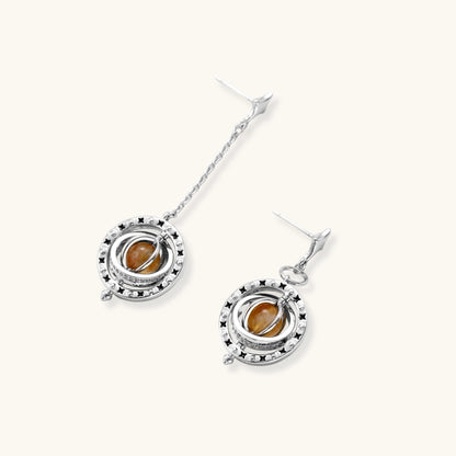 Complete jewelry set featuring citrine stone chips, silver beads, and cosmic circle pendants on cream background.