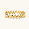 18K gold plated stainless steel bangle with dual rows of polished oval pebble beads on a cream background.