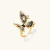 Gold-plated adjustable ring featuring iridescent shell pieces in purple, blue and green tones arranged in butterfly formation