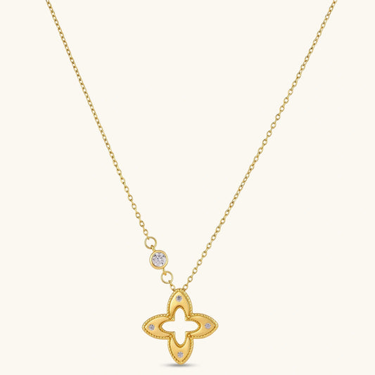 18K gold-plated 925 silver necklace with open four-petal flower pendant, CZ accents, bezel-set stone on chain, white background.